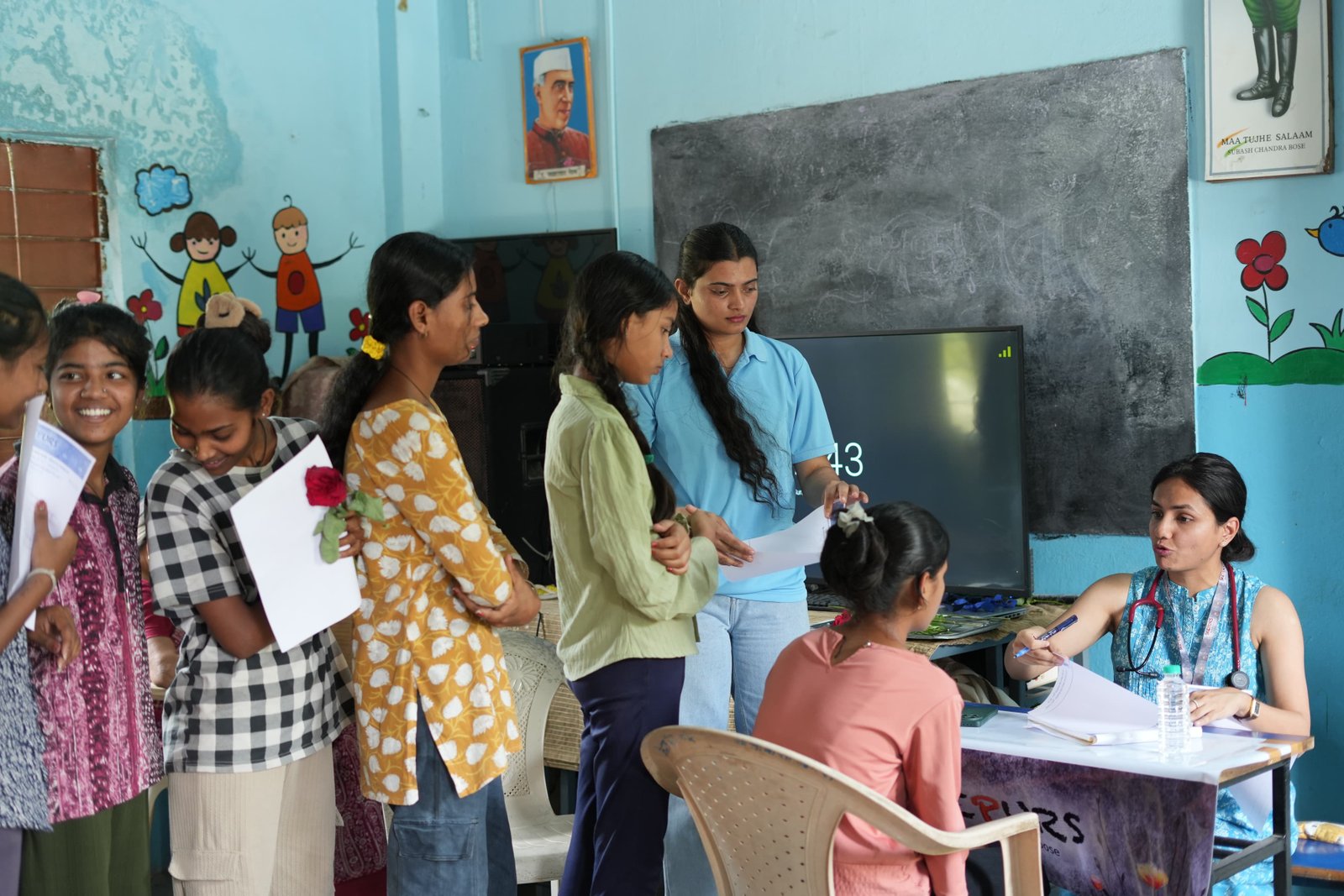 Dr Vaishnavi consulting child patient at camp
